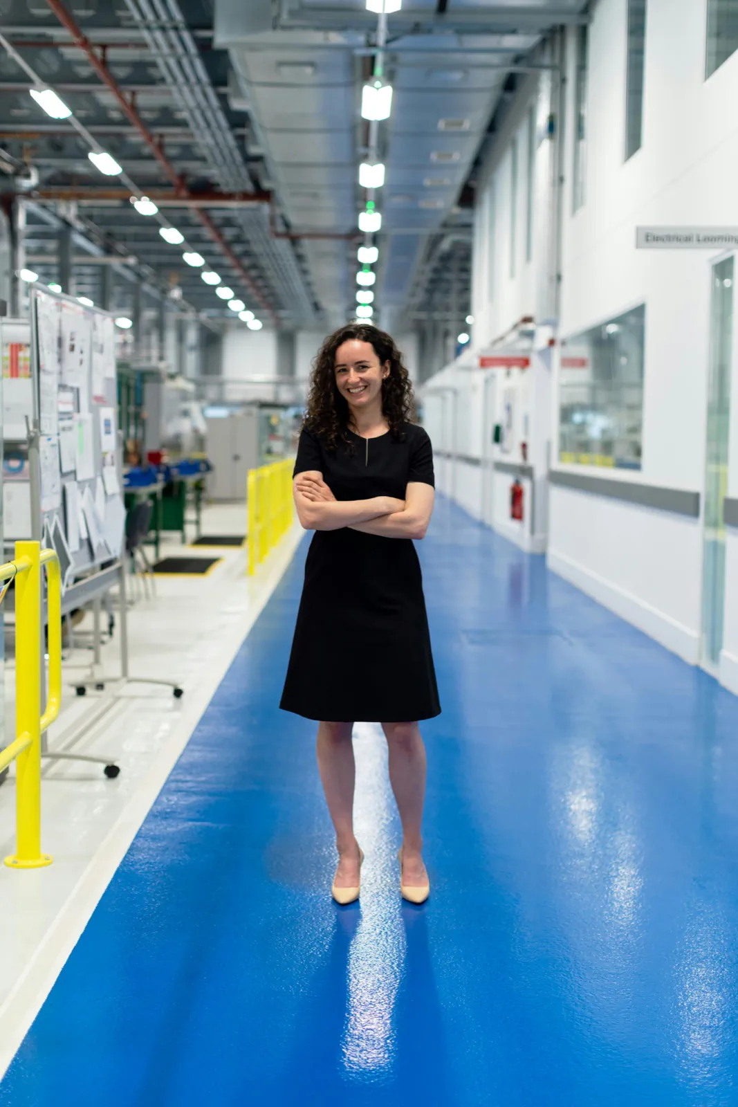 Manufacturing professional working inside a modern production facility